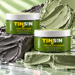 Farrell Naturals Acne Face Mask and Purifying Clay Face Mask jars surrounded by contrasting dark and green clay textures.