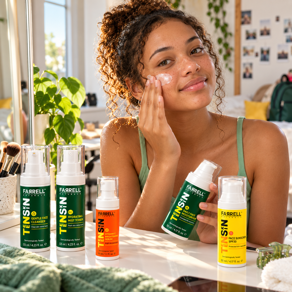 Teenage girl applying skincare at a sunny vanity with the five Farrell Naturals daily skincare products displayed nearby.