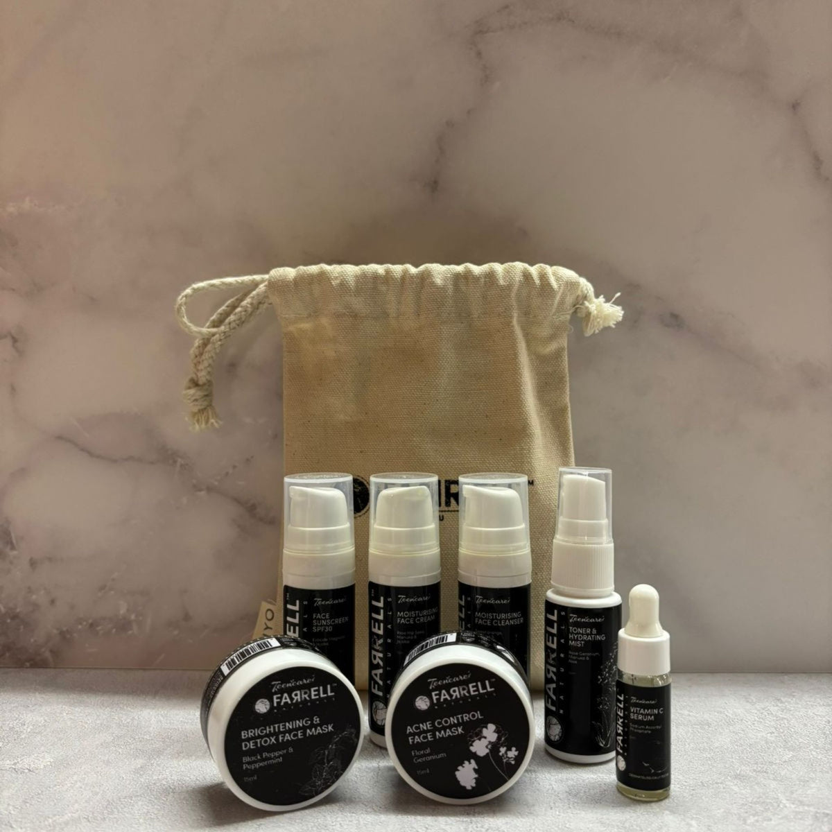 Farnell skincare products including bottles and jars on a marble surface